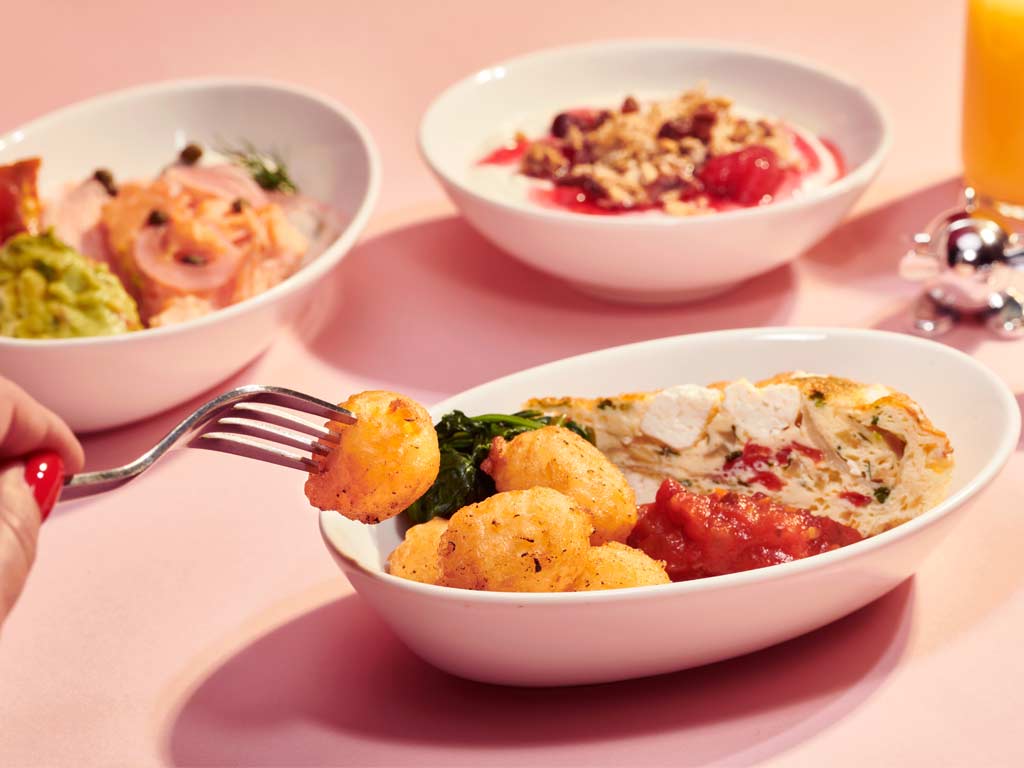 Breakfast options include a pepper and feta frittata with mini hash browns, spinach and roasted tomato chutney (v) and continental style flaked oak smoked salmon, horseradish cream cheese, crushed avocado, pickled red onion, sun dried tomato and capers with a warm bagel 