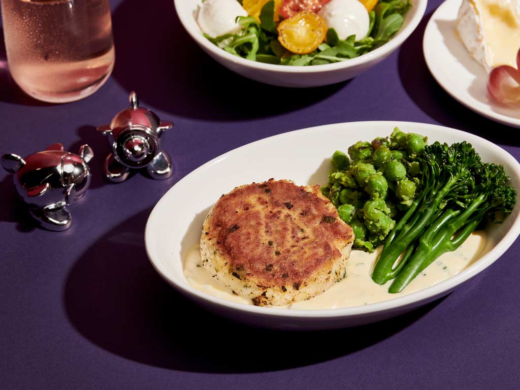 Cod fishcake with crushed minted peas, tenderstem broccoli and a lemon thyme cream 