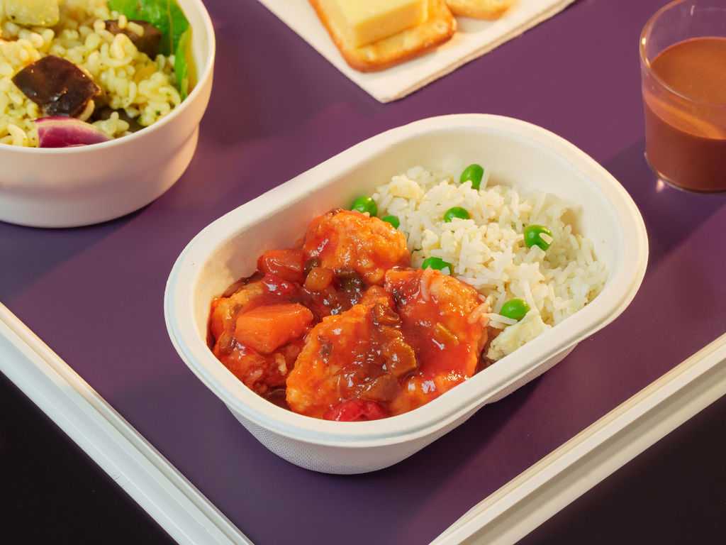 Sweet and Sour Chicken with roasted peppers and pineapple, served with egg fried rice