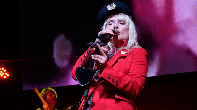 Debbie Harry looks immaculate in our fabulous new Vivienne Westwood-designed red jacket