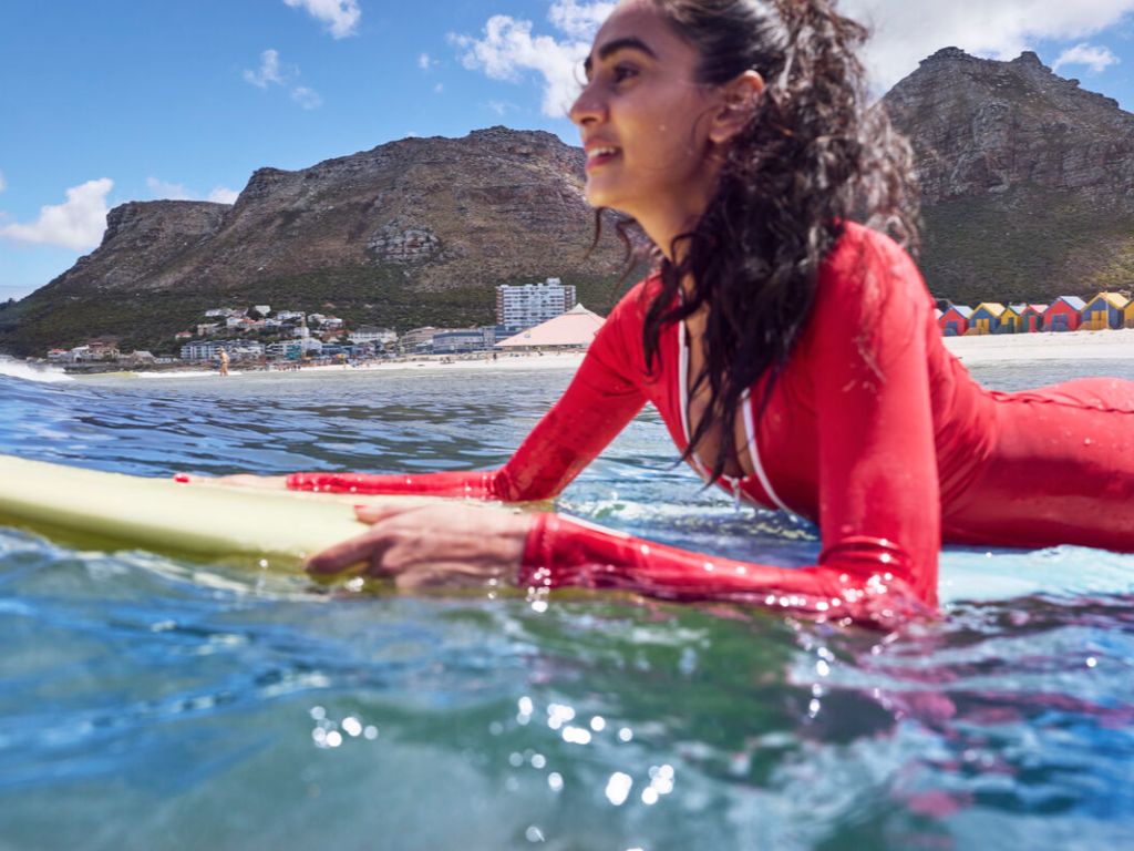 Woman surfing in Cape Town